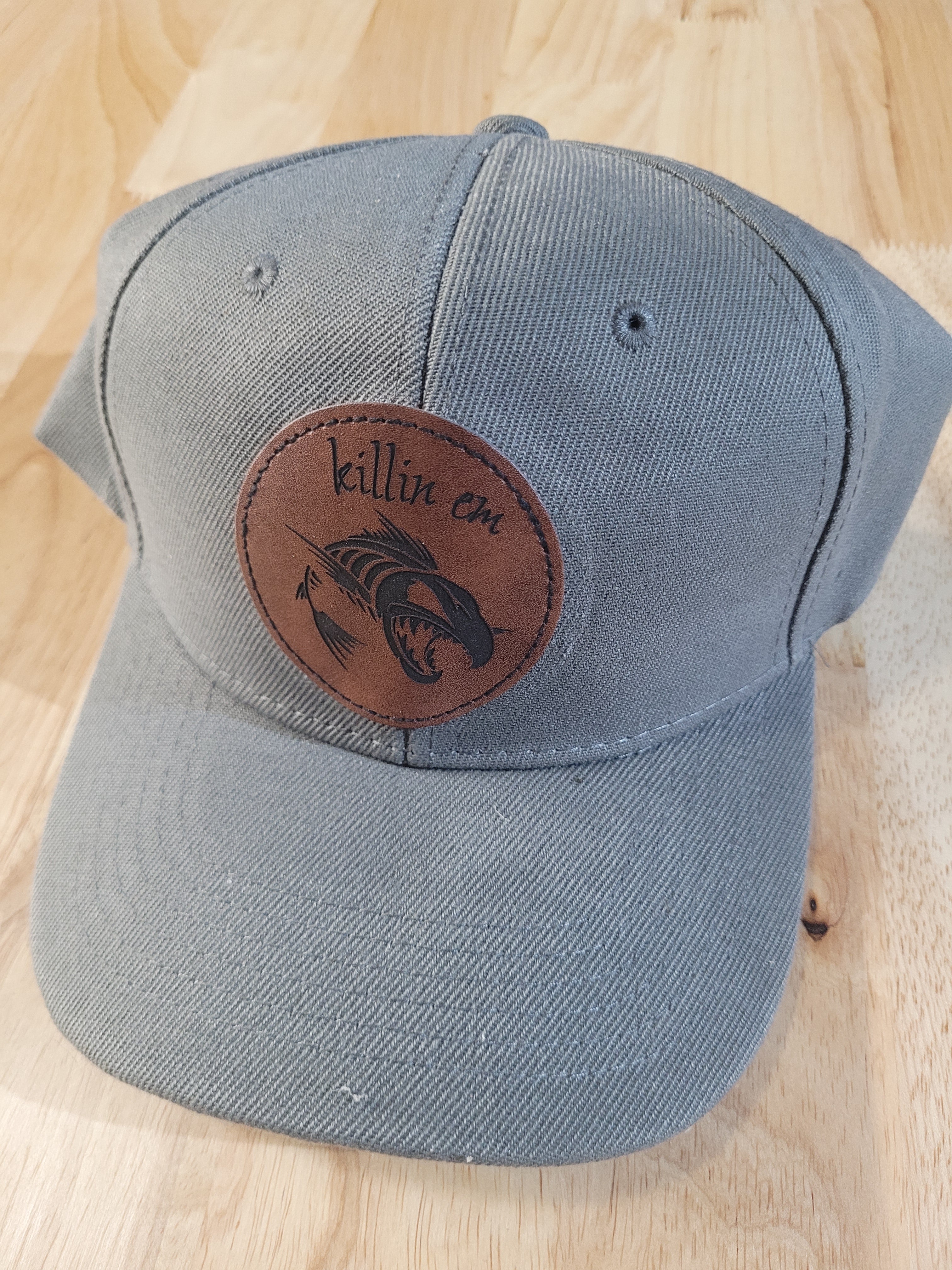 Gray Ball Cap with "killin em" engraved patch