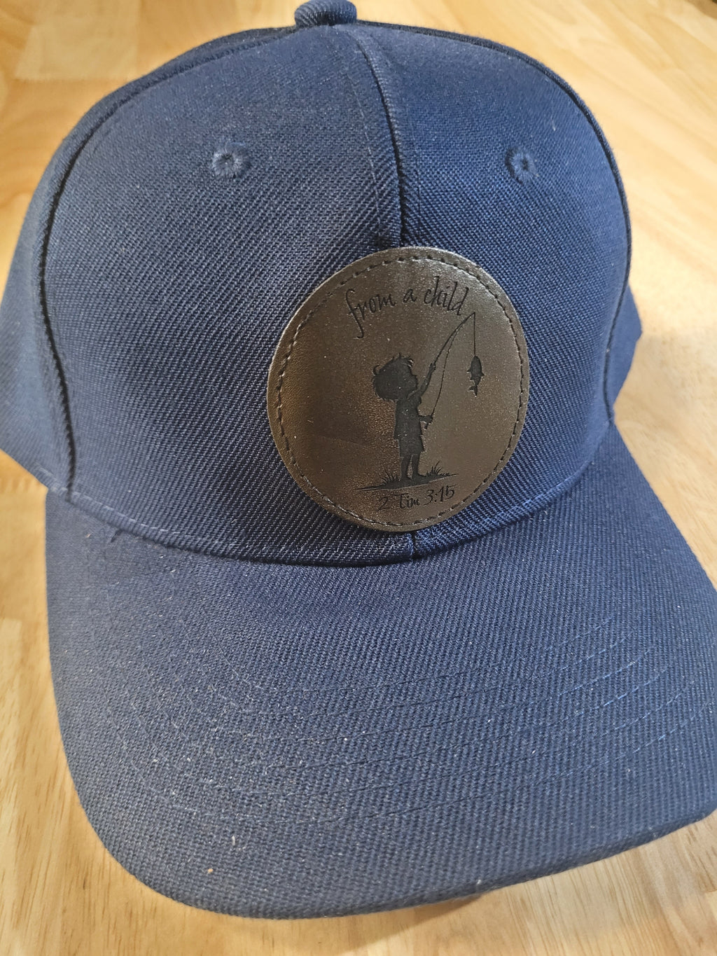 Blue Ball Cap with "from a child 2Tim 3:15" little boy fishing engraved patch