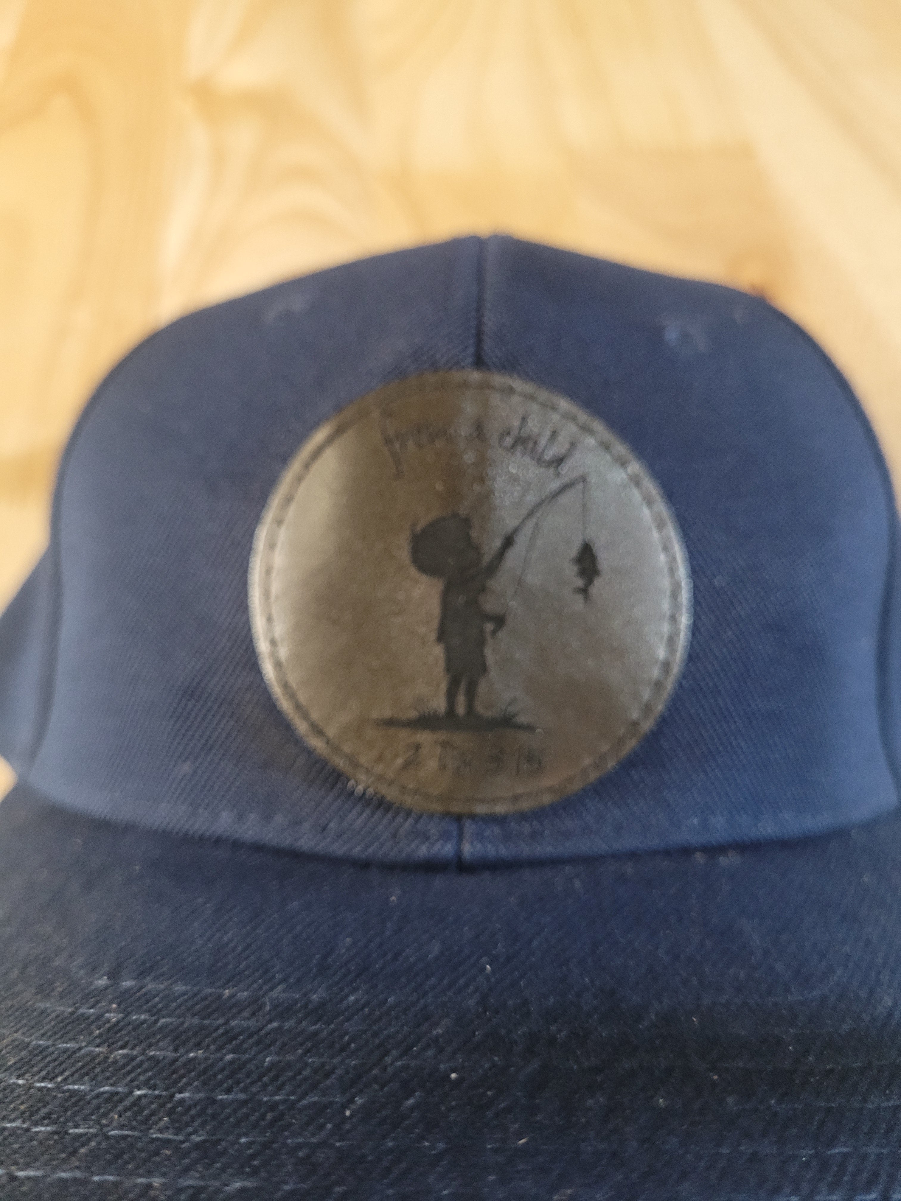 Blue Ball Cap with "from a child 2Tim 3:15" little boy fishing engraved patch