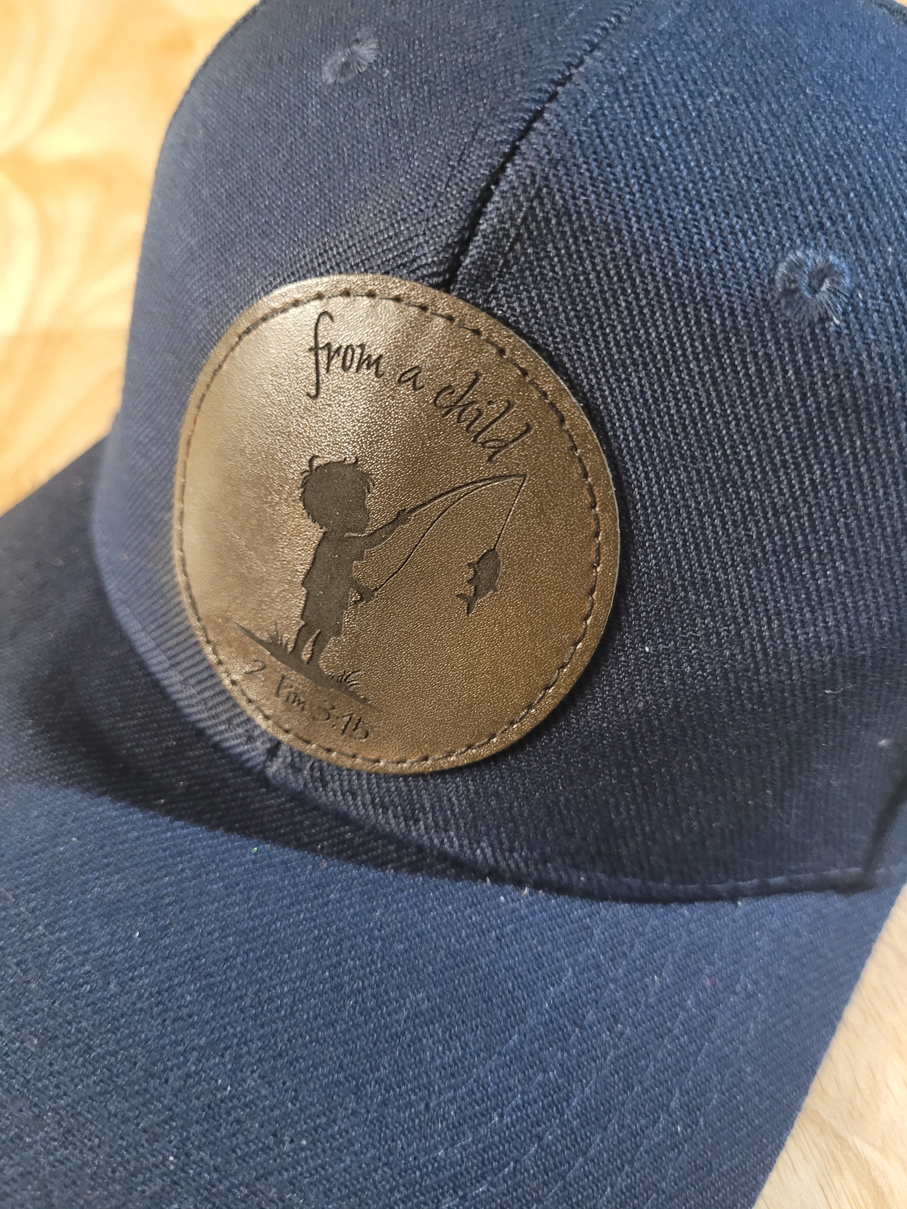 Blue Ball Cap with "from a child 2Tim 3:15" little boy fishing engraved patch