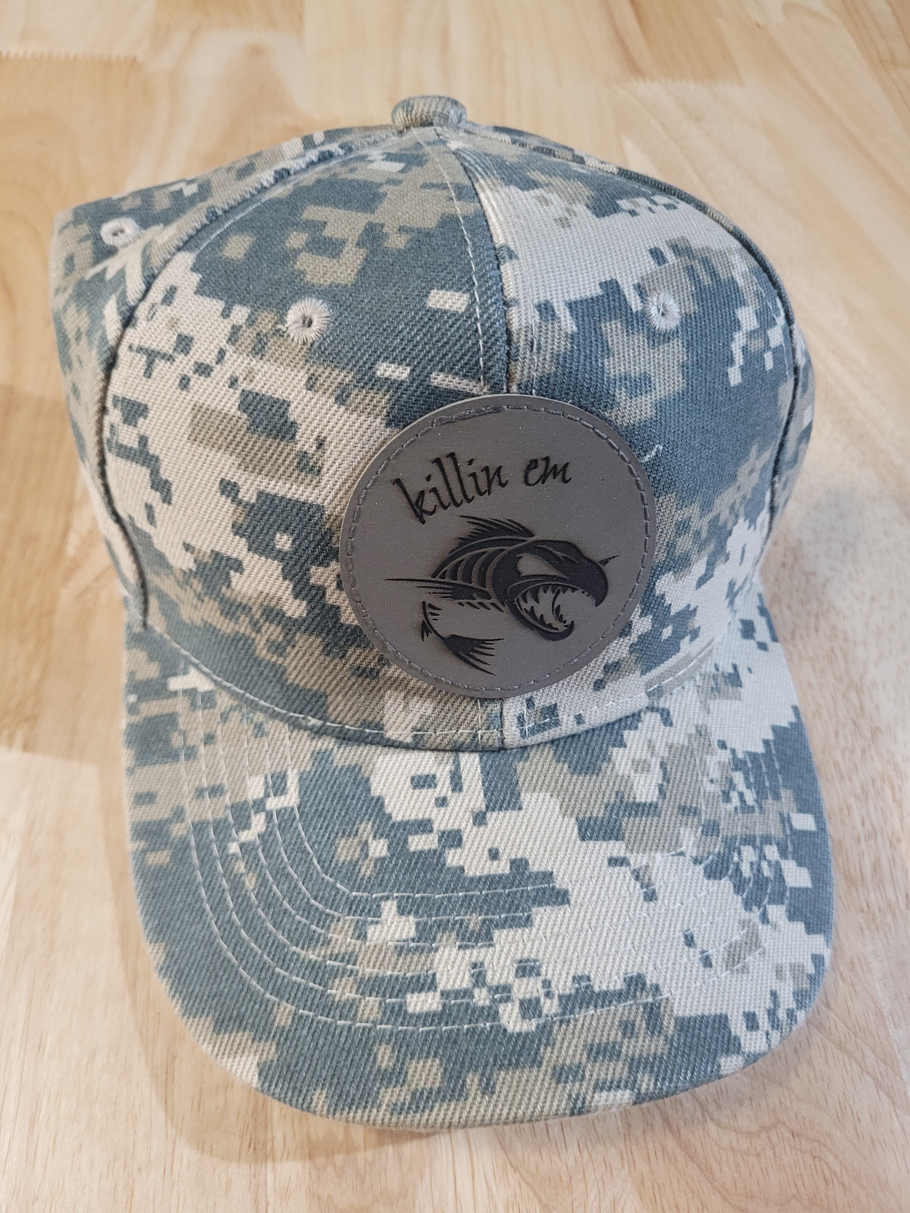 Digital Camo Ball Cap with a "killin em" fish skeleton patch