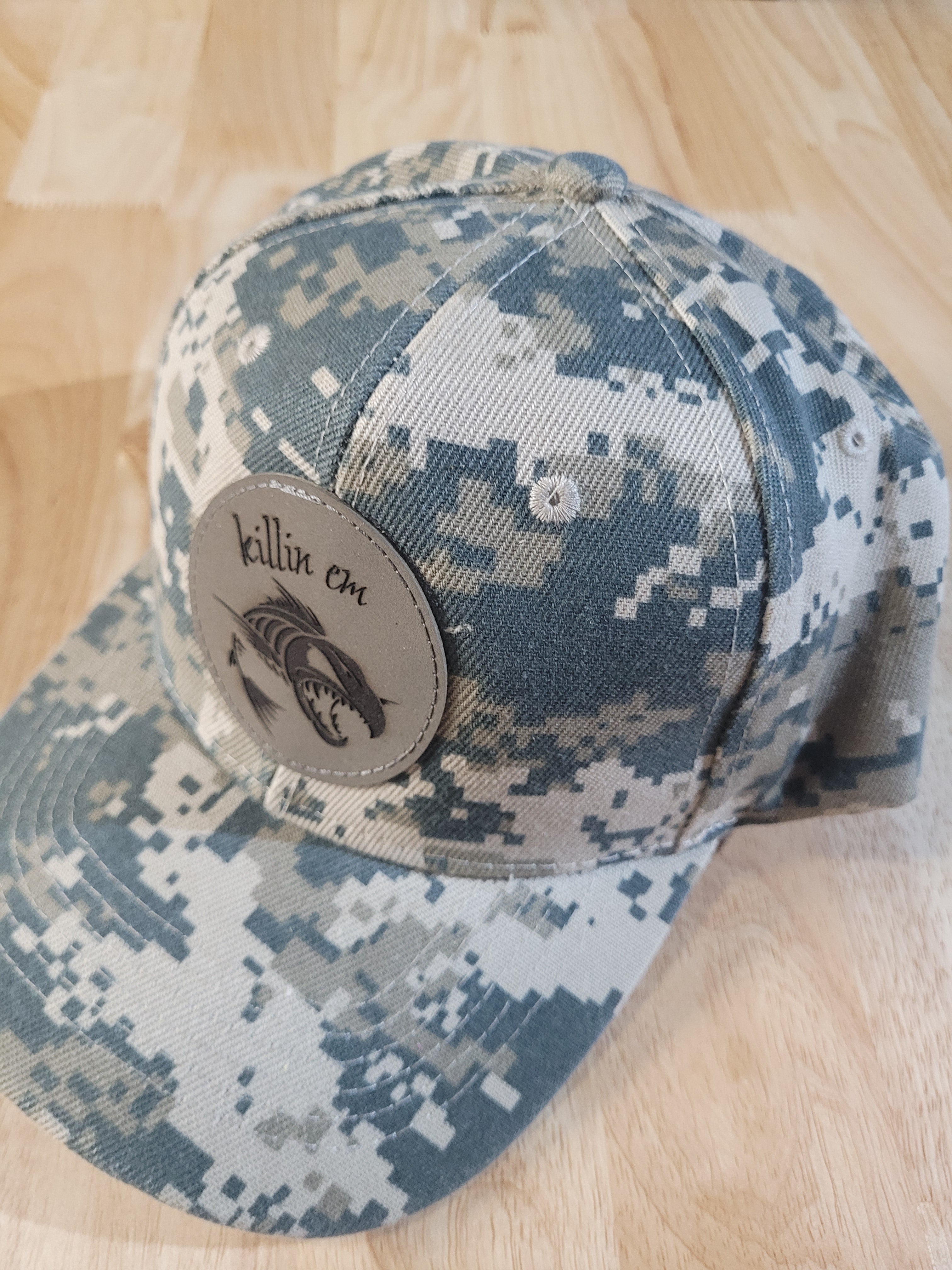 Digital Camo Ball Cap with a "killin em" fish skeleton patch