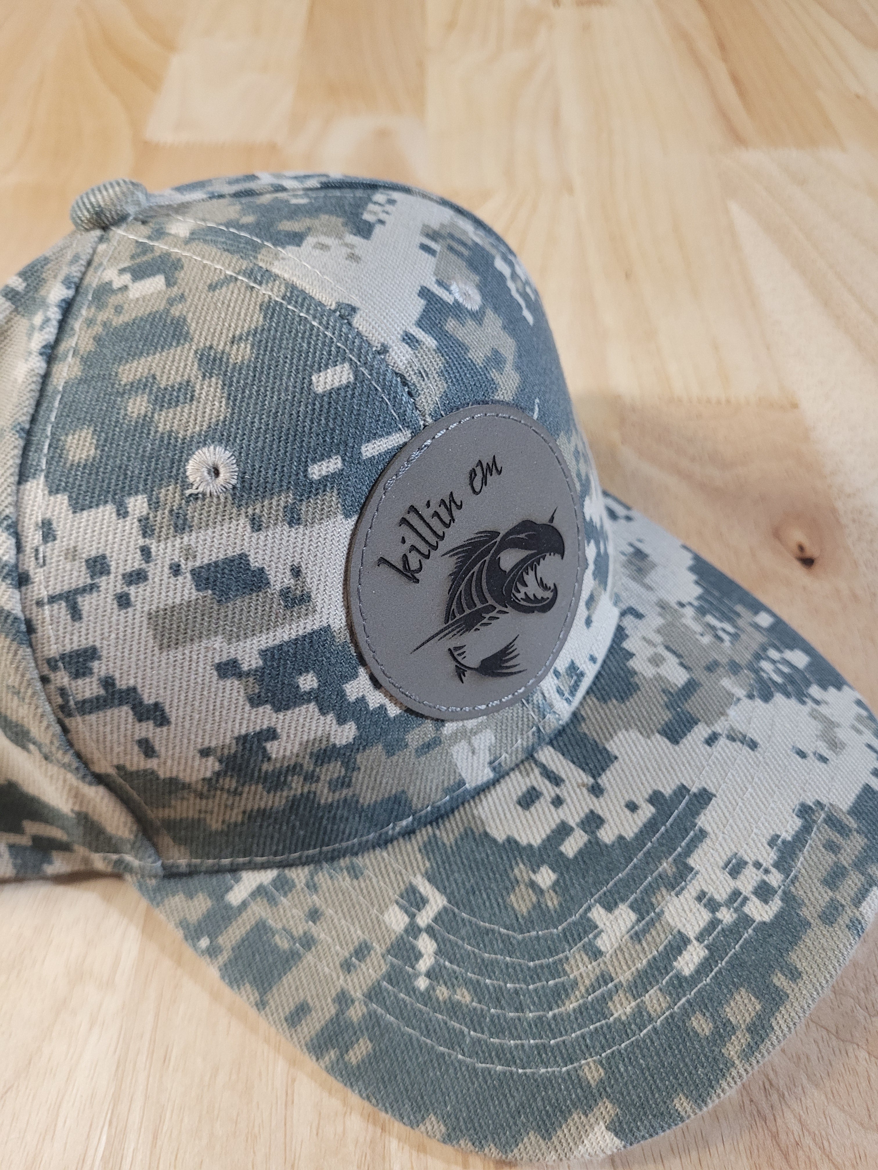 Digital Camo Ball Cap with a "killin em" fish skeleton patch