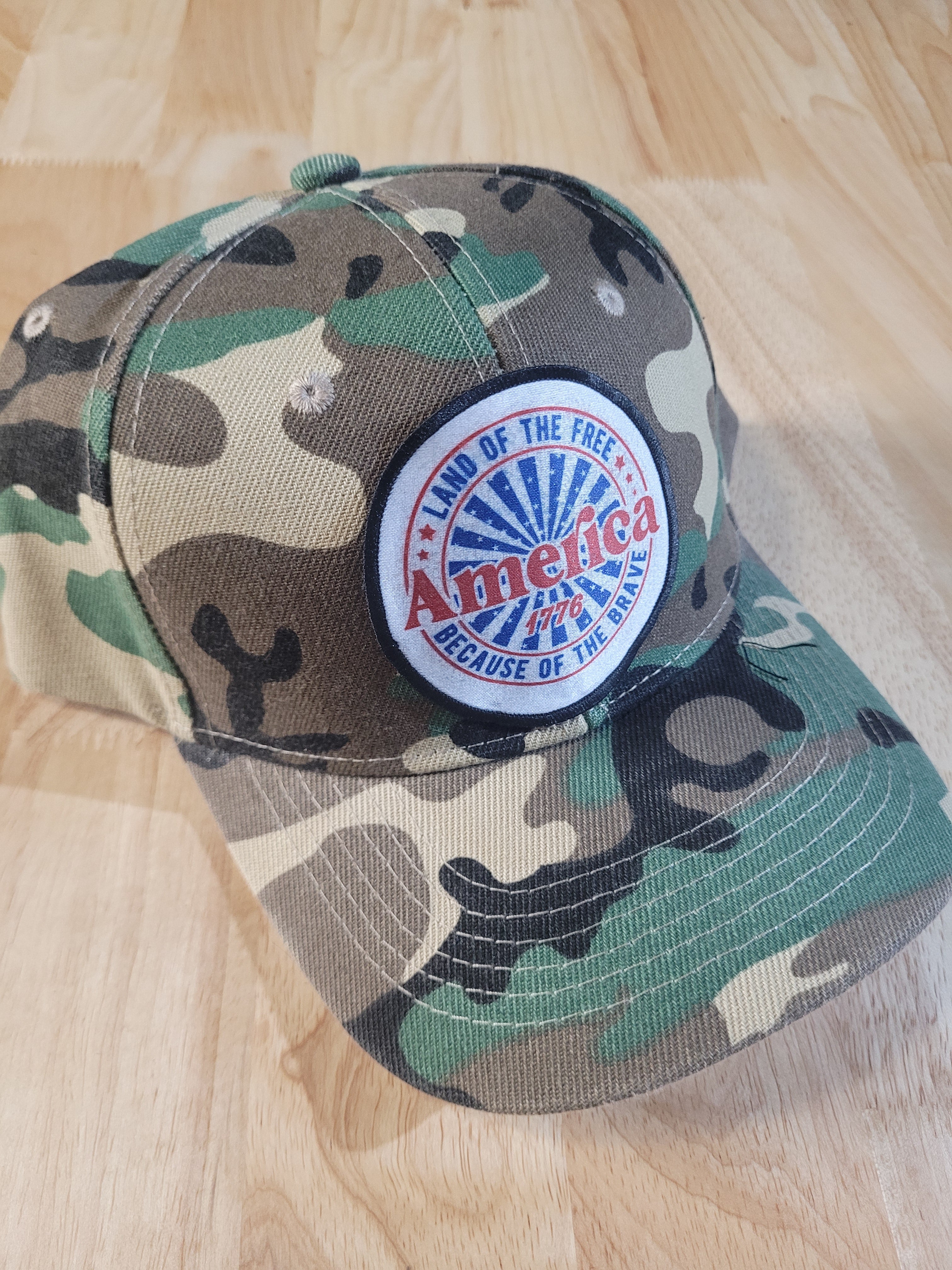 Camo Ball Cap with "America 1776 Land of the Free Because of the Brave"