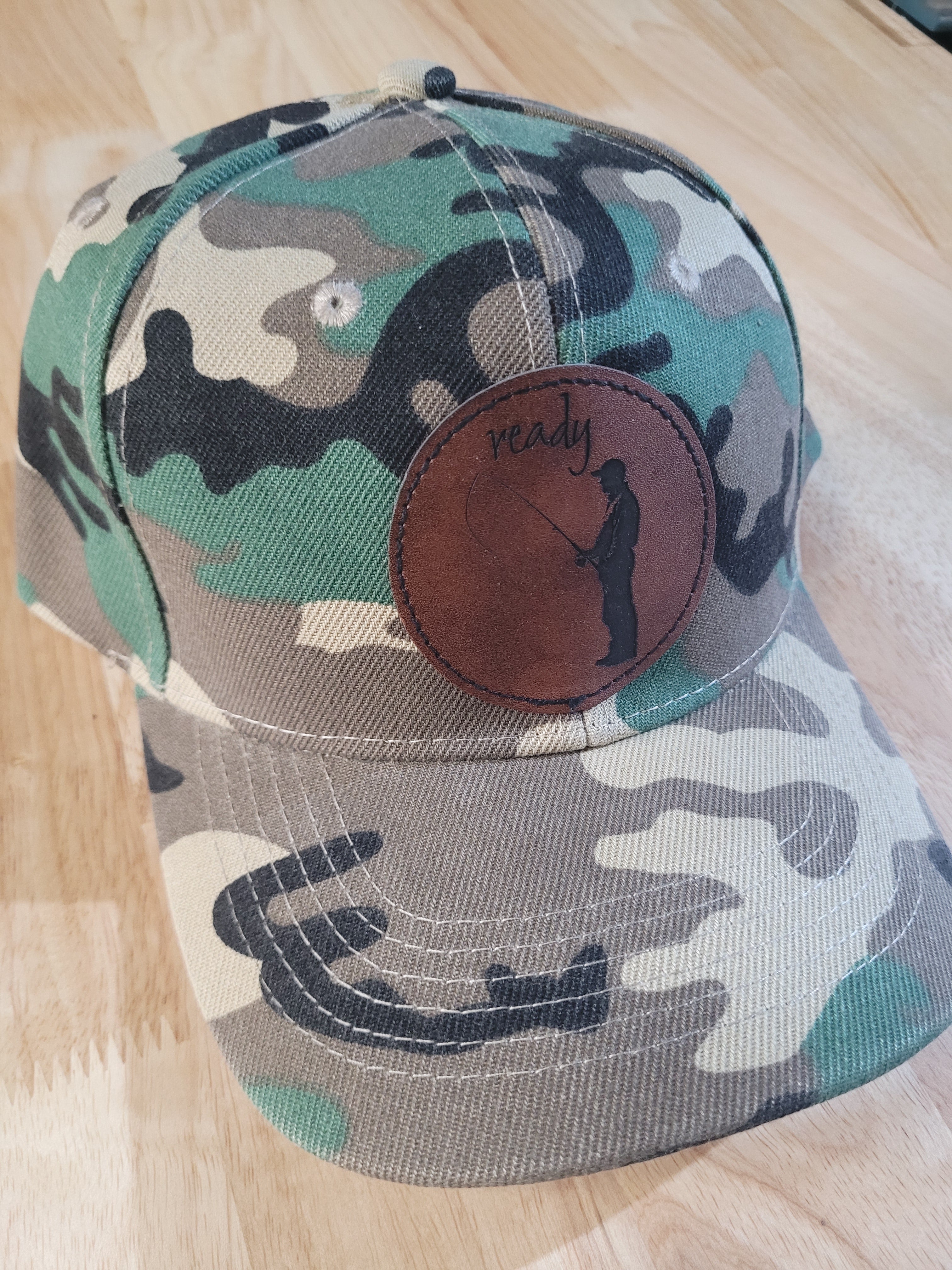 Camo Ball Cap with path of "Ready" fisherman silhouette