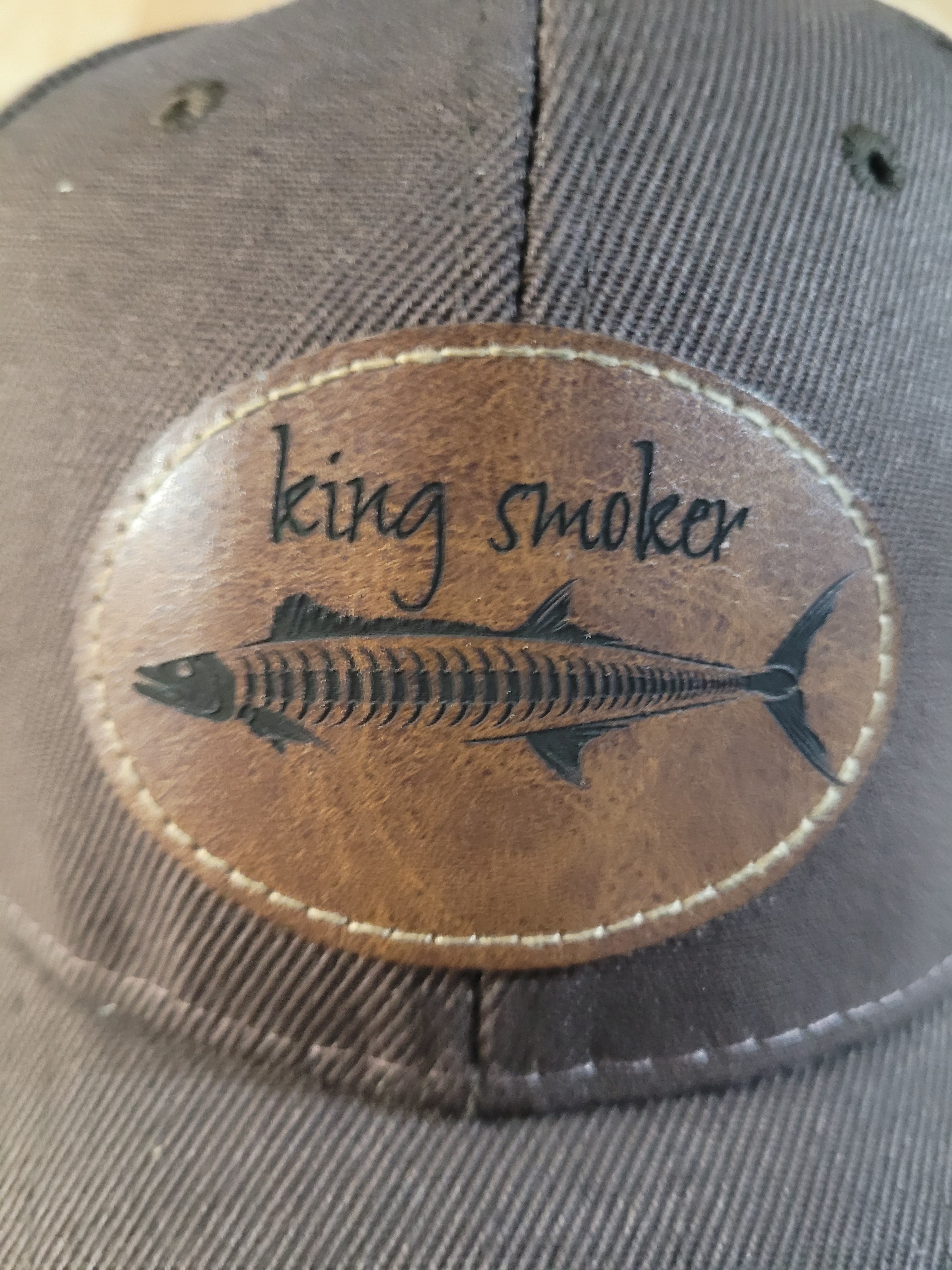 "King Smoker"  Brown Ball Cap with a  King Mackerel Fish Skeleton