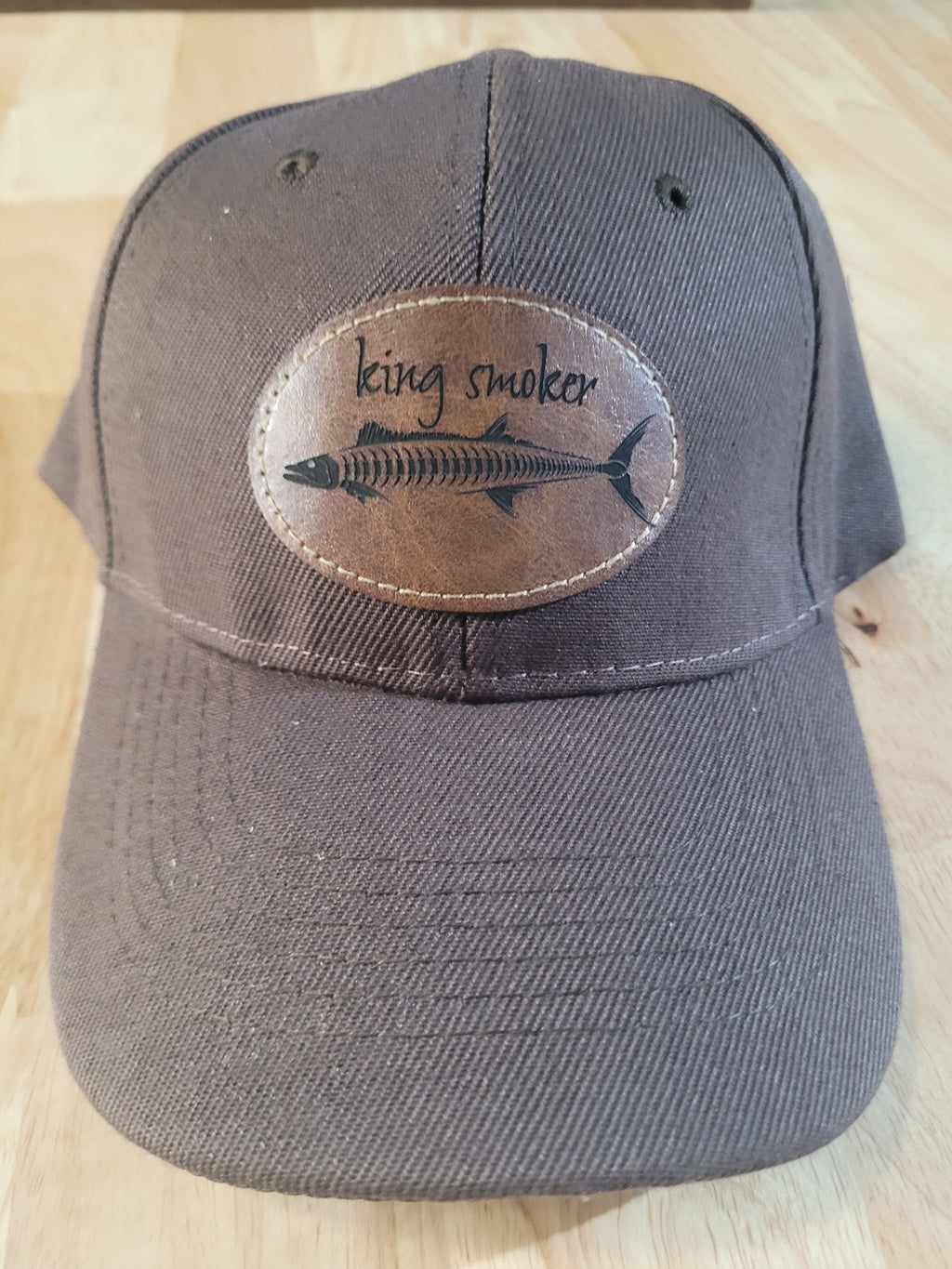 "King Smoker"  Brown Ball Cap with a  King Mackerel Fish Skeleton