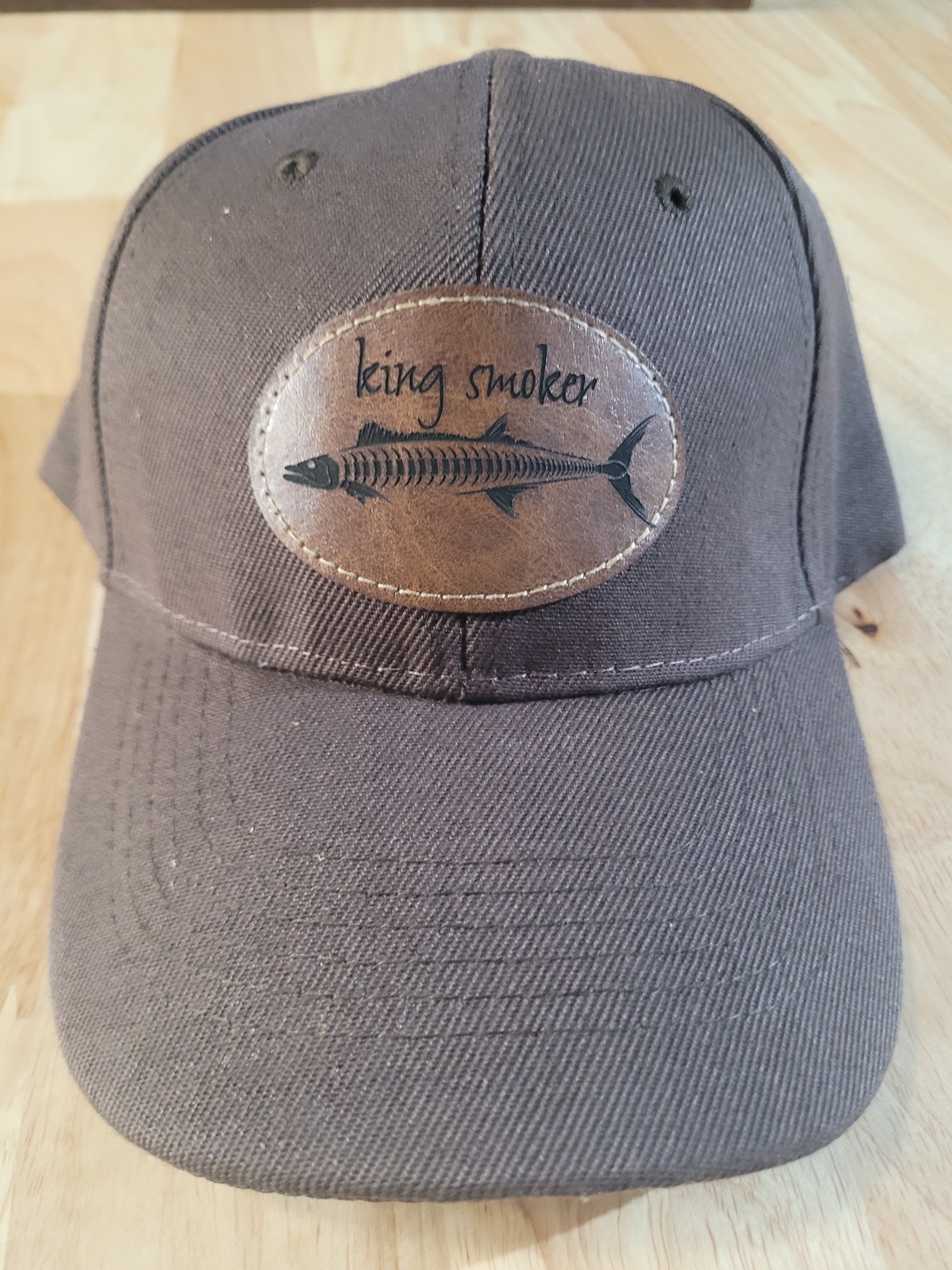 "King Smoker"  Brown Ball Cap with a  King Mackerel Fish Skeleton