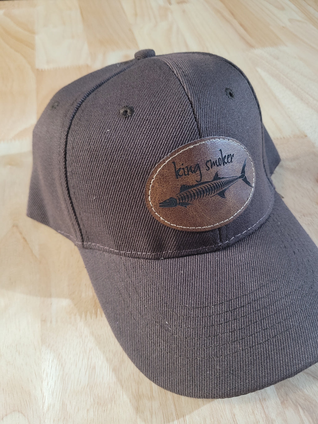 "King Smoker"  Brown Ball Cap with a  King Mackerel Fish Skeleton