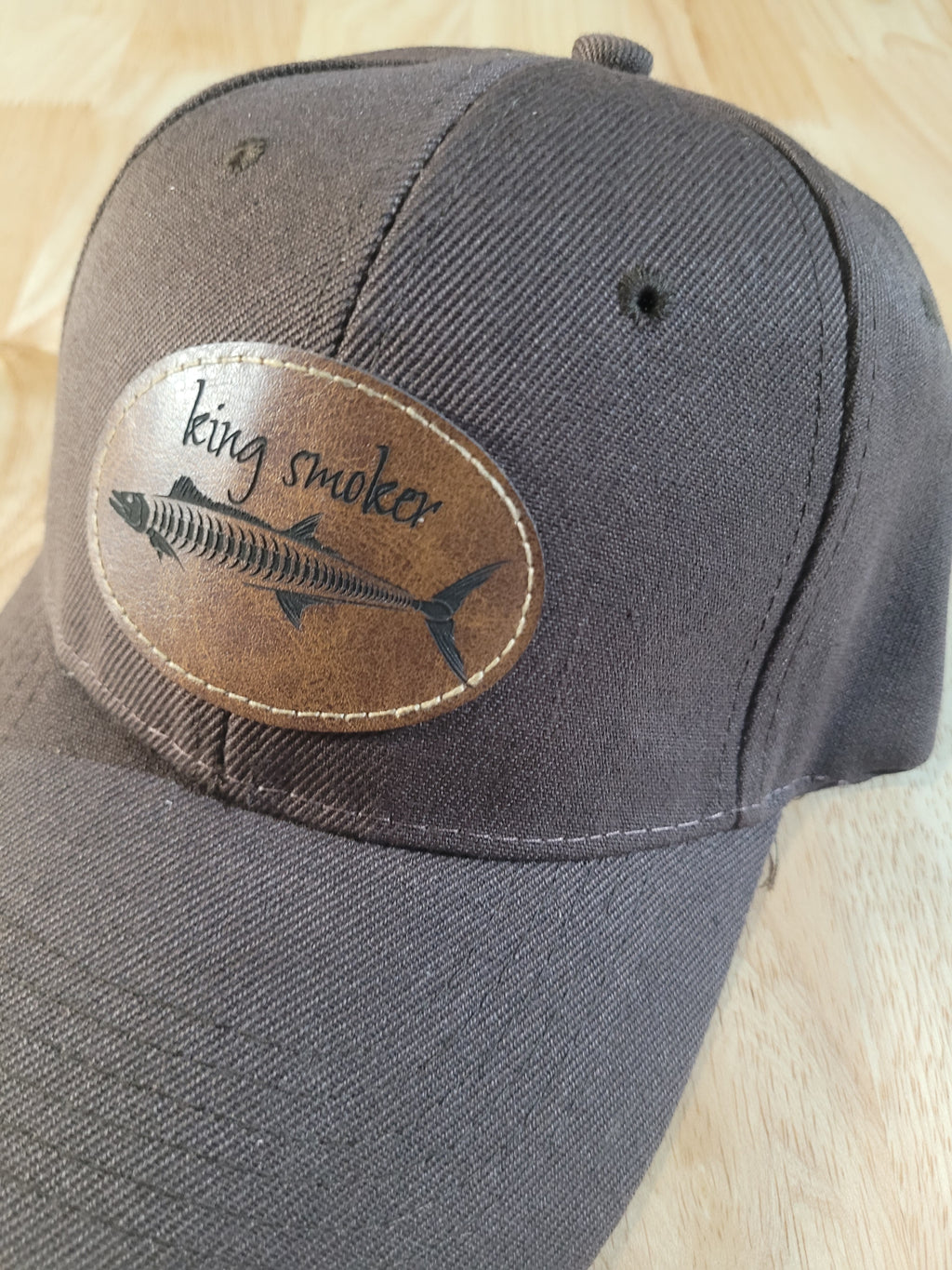 "King Smoker"  Brown Ball Cap with a  King Mackerel Fish Skeleton