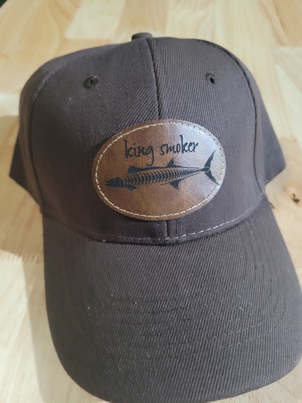 "King Smoker"  Brown Ball Cap with a  King Mackerel Fish Skeleton