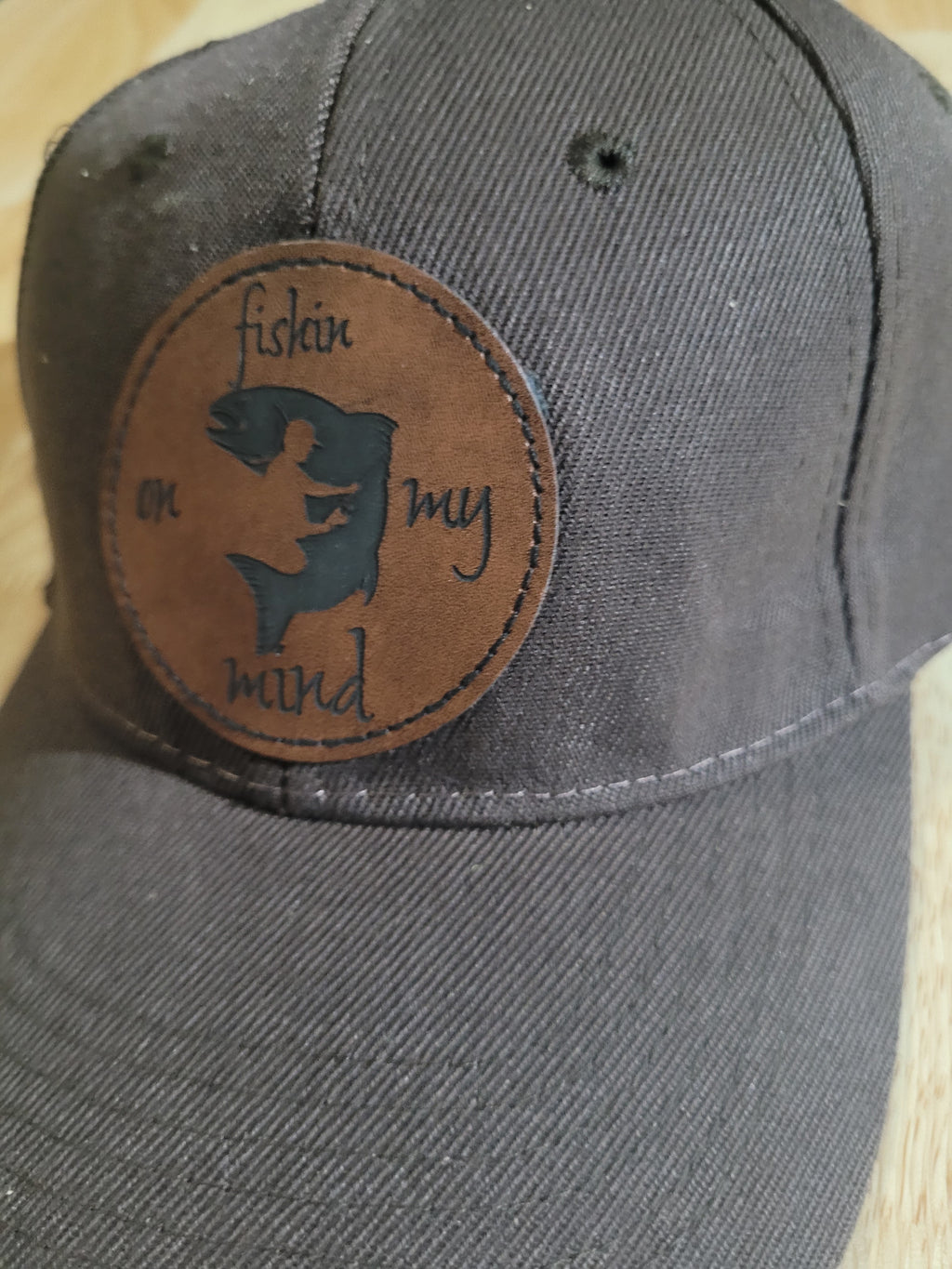 "Fishin On My Mind" patch on a Brown Ball Cap