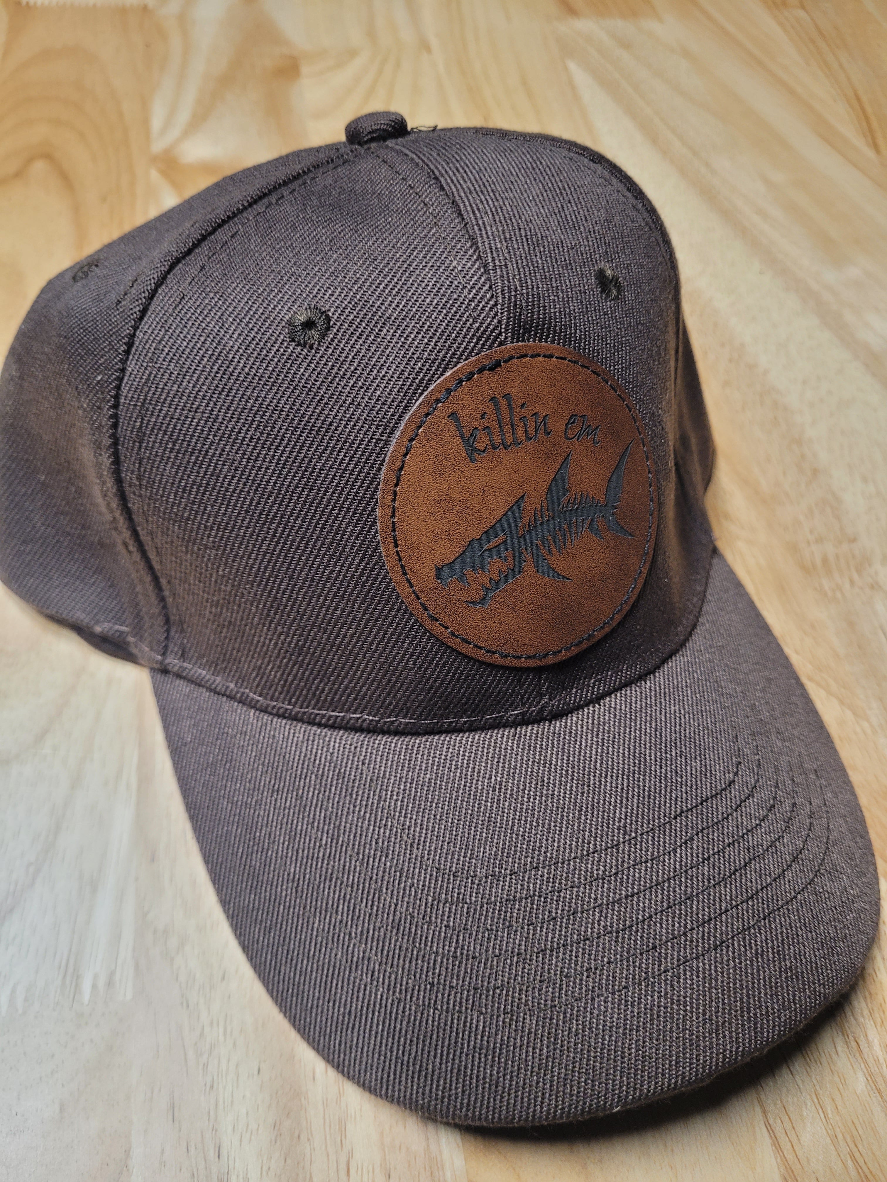 Brown Ball Cap with a fish skeleton patch saying "killin em"