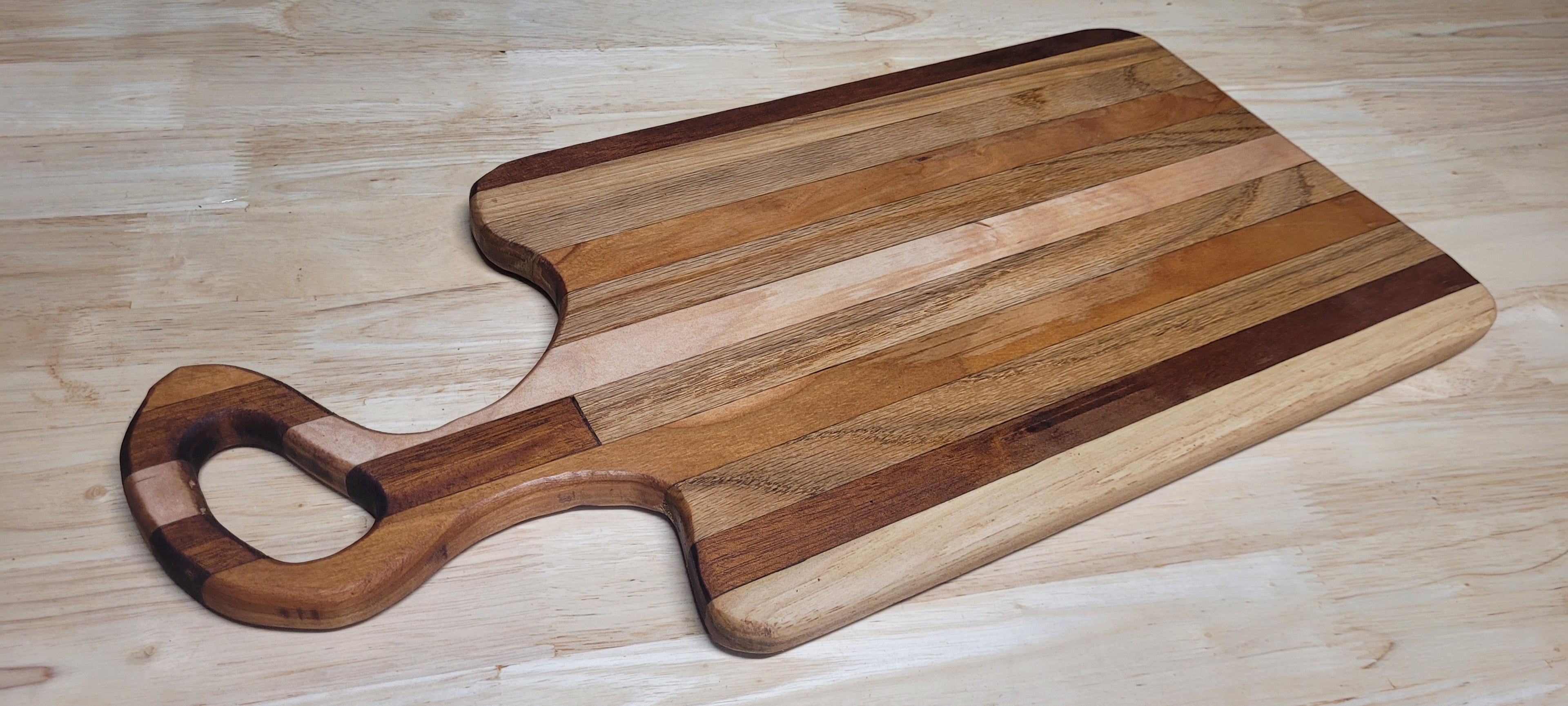 Multi Wood Charcuterie Board Oak, Maple, and Mahogany woods Approximately 19.5"L X 9.5"W