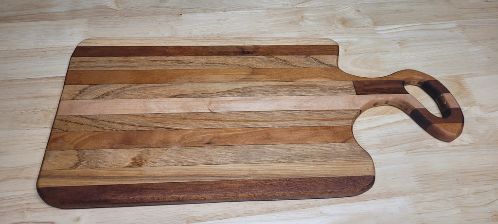 Multi Wood Charcuterie Board Oak, Maple, and Mahogany woods Approximately 19.5"L X 9.5"W