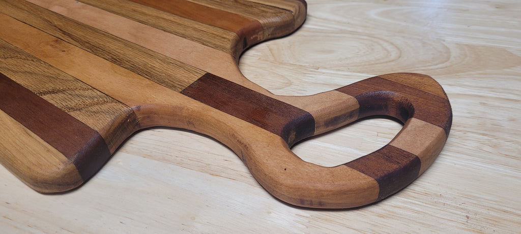 Multi Wood Charcuterie Board Oak, Maple, and Mahogany woods Approximately 19.5"L X 9.5"W