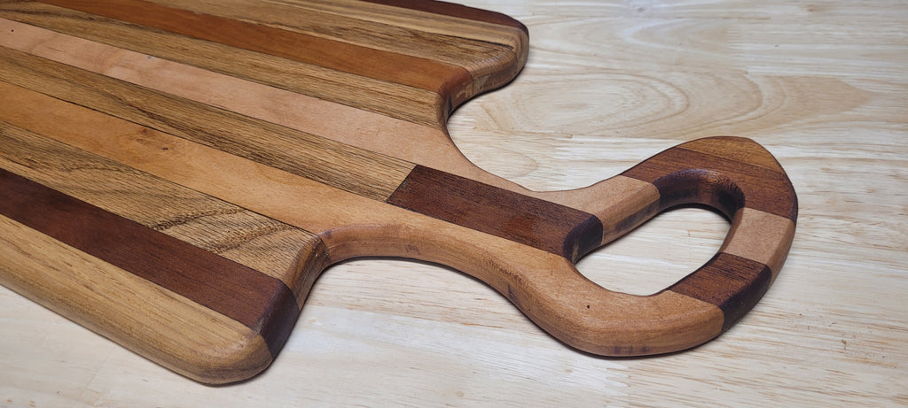 Multi Wood Charcuterie Board Oak, Maple, and Mahogany woods Approximately 19.5"L X 9.5"W