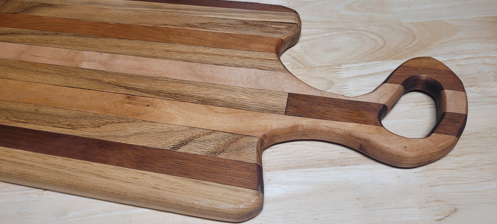 Multi Wood Charcuterie Board Oak, Maple, and Mahogany woods Approximately 19.5"L X 9.5"W