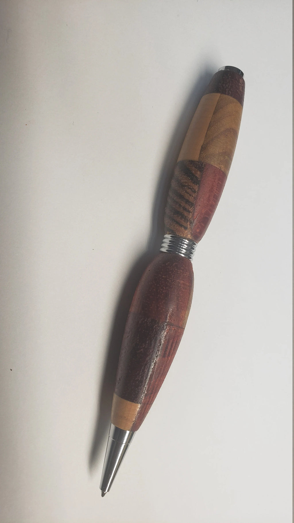 Multi Wood Twist Pen made of  Zebrawood, Padauke Wood, Maple, and Purpleheart Woods