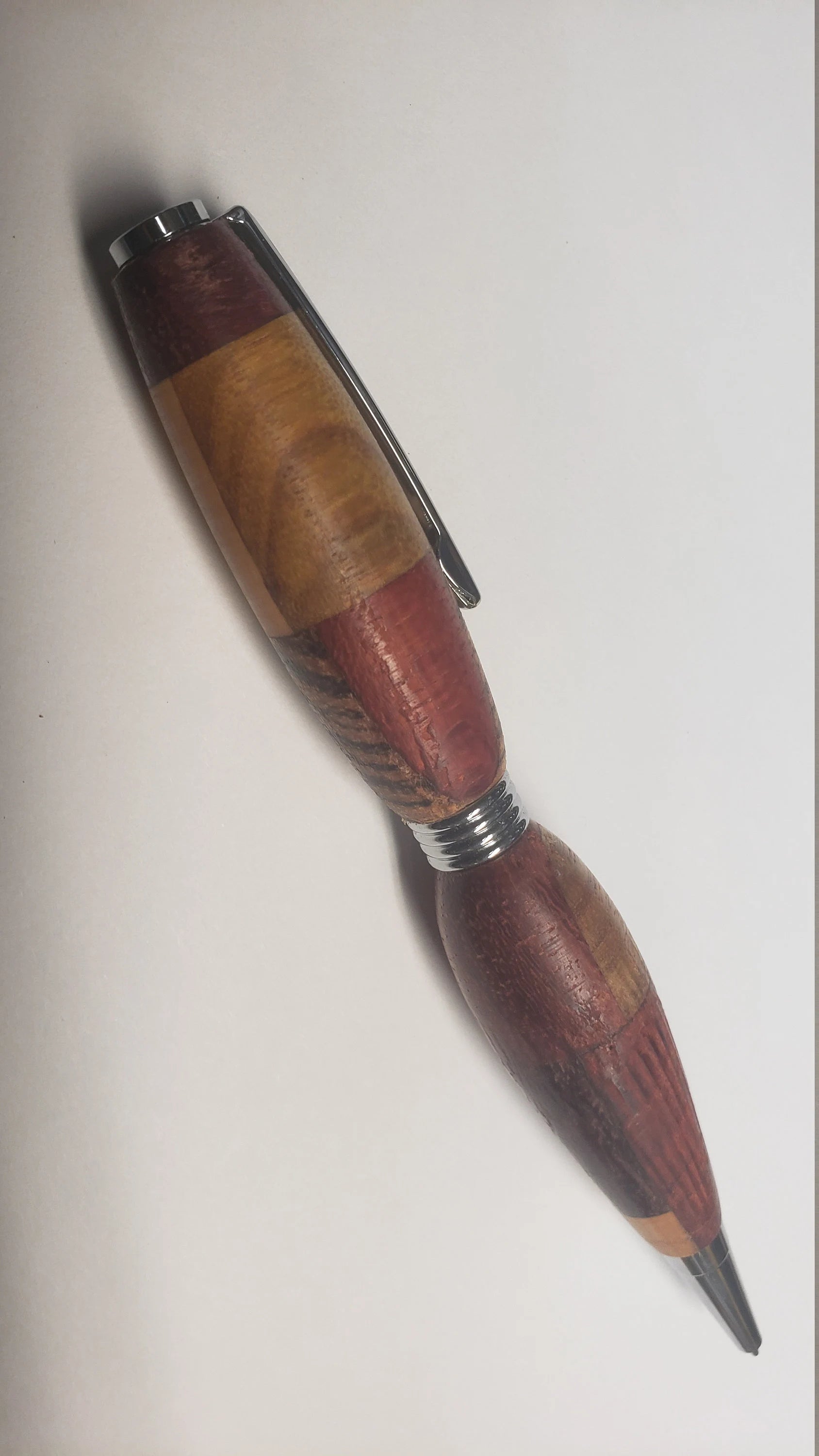 Multi Wood Twist Pen made of  Zebrawood, Padauke Wood, Maple, and Purpleheart Woods