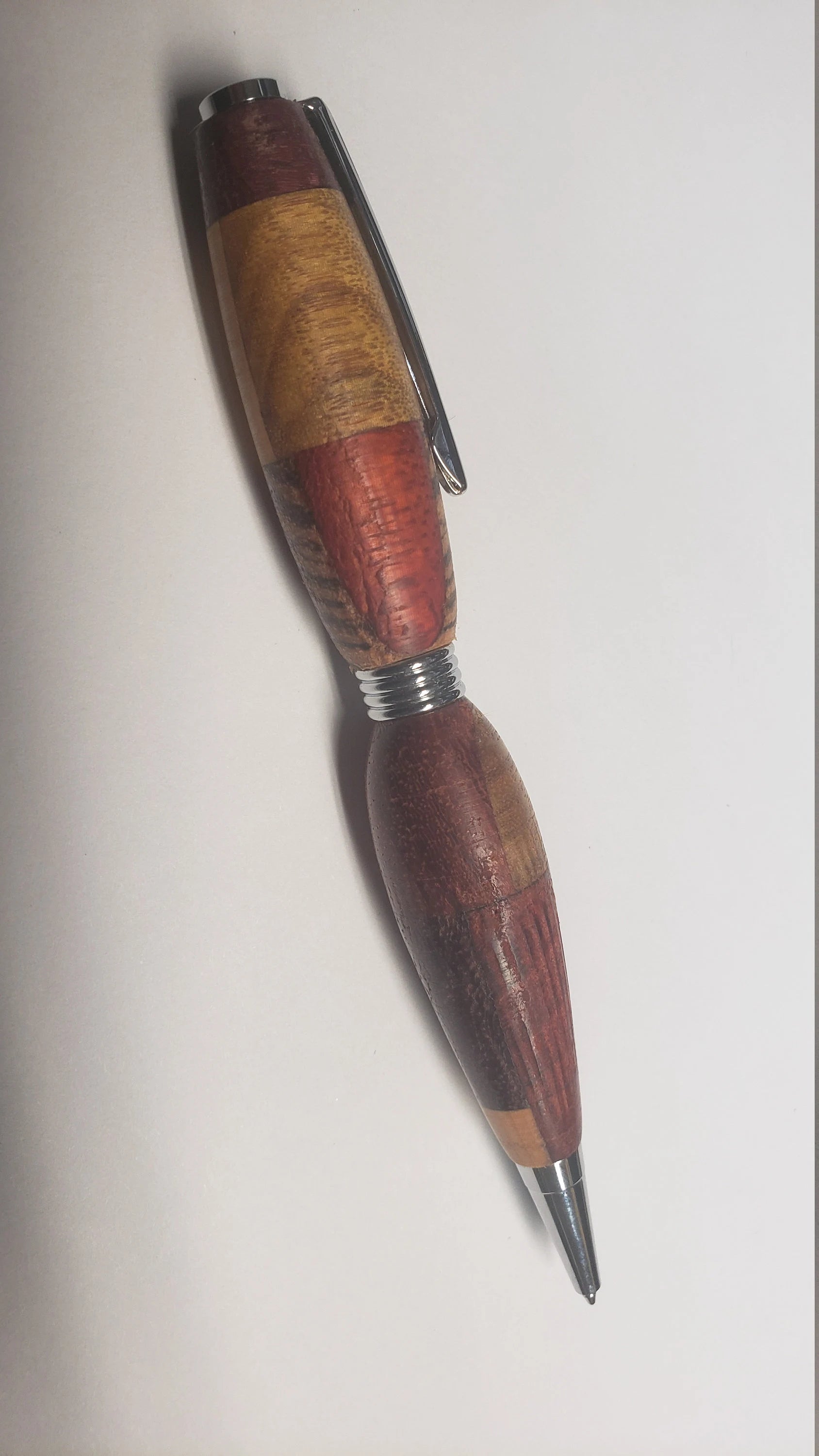 Multi Wood Twist Pen made of  Zebrawood, Padauke Wood, Maple, and Purpleheart Woods