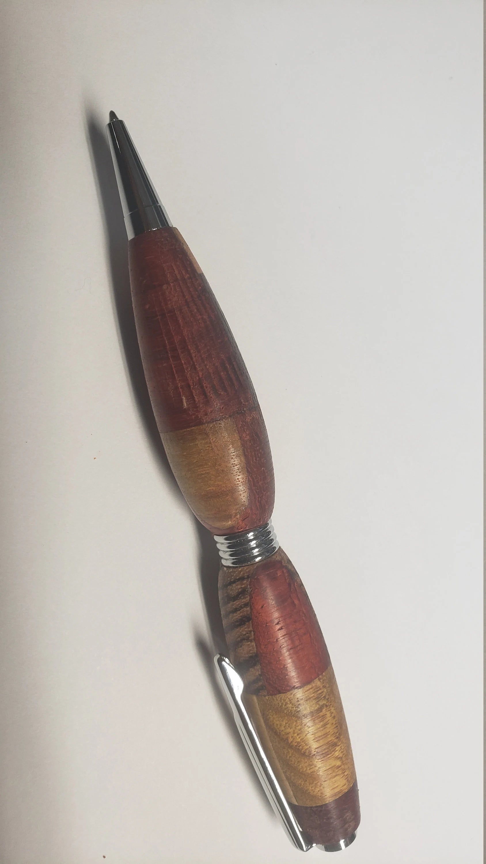Multi Wood Twist Pen made of  Zebrawood, Padauke Wood, Maple, and Purpleheart Woods